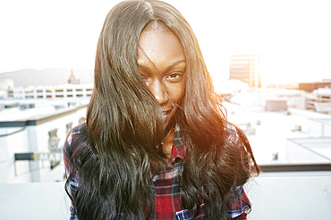 Portrait of Black woman on rooftop