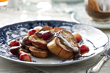 French toast with syrup and cherries