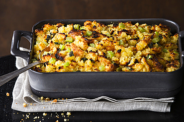 Spoon in tray of stuffing