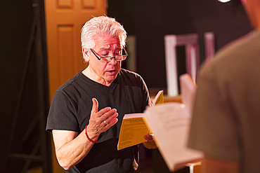 Teacher talking to students in theater class