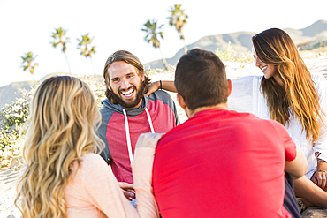 Friends laughing at beach