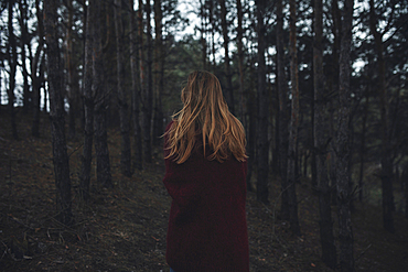 Caucasian woman standing in forest