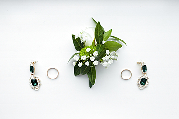 Corsage, earrings and wedding rings