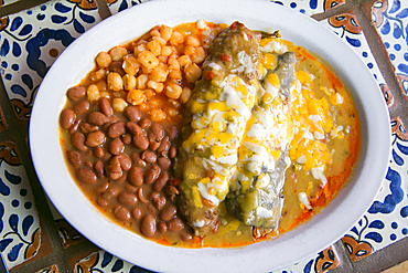 Enchiladas and beans in bowl