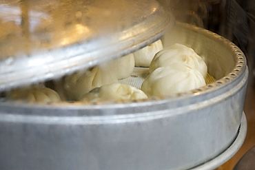 Buns steaming in pan