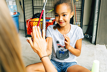 Sisters playing hand clapping game