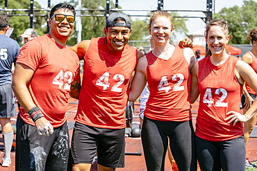 Portrait of friends wearing shirts with number 42