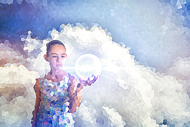 Pixelated Mixed Race girl holding glowing sphere