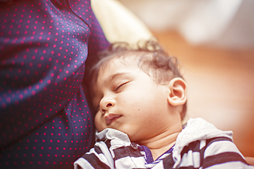 Indian mother holding baby son