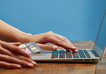 Hands of woman online shopping with laptop