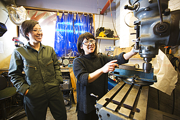 Women using machinery in workshop