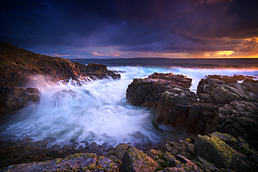 Waves flowing on rocky beach