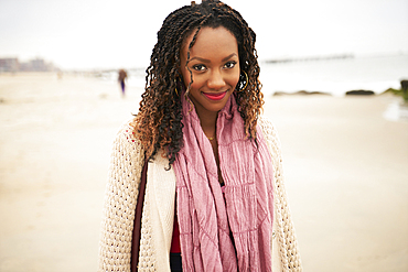 Black woman smiling on beach