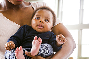 Black mother holding baby son