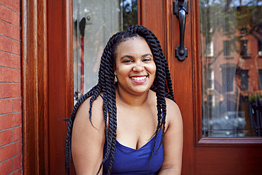 Smiling Black woman in doorway