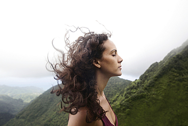 Wind blowing hair of Mixed Race woman