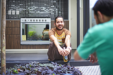 Hispanic man smiling in atrium