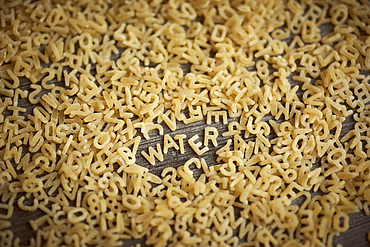 Alphabet noodles spelling water