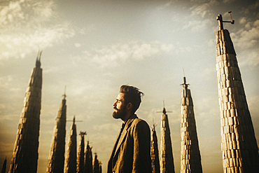 Caucasian man with beard standing near pillars