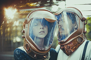 Caucasian couple wearing diving helmets