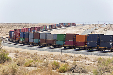 Cargo containers on curving railroad track