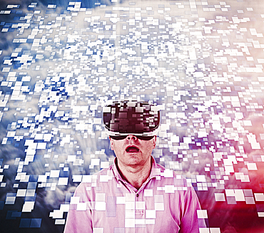 Caucasian man using vr goggles watching floating pixels