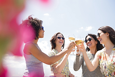 Women drinking wine outdoors