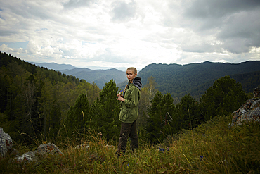 Portrait of Caucasian girl standing on mountain range