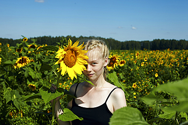 Caucasian girl holding sunflower