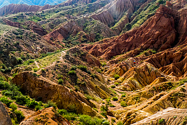 Caucasian couple hiking in rocky landscape