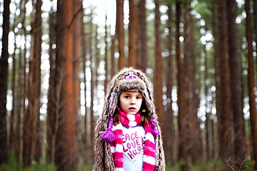 Caucasian girl standing in forest