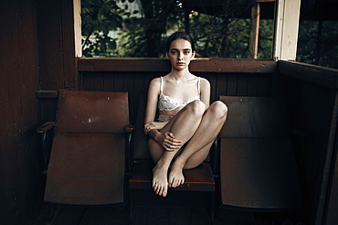 Caucasian woman sitting in chair