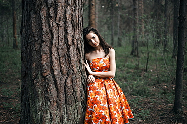 Caucasian woman standing in forest