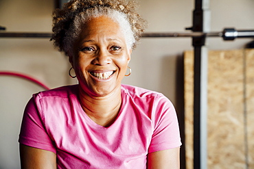 Black woman smiling in garage