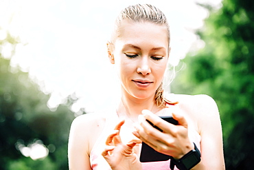 Caucasian woman using cell phone outdoors