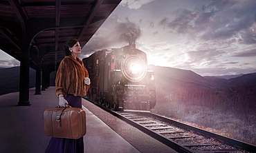 Caucasian woman waiting in train station