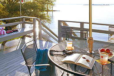 Patio table on deck by lake