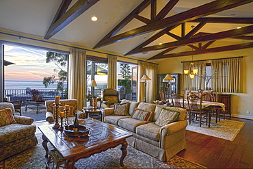 Great room with large windows at sunset, Laguna Beach, California, USA