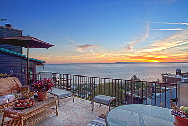 Ocean view patio at sunset, Laguna Beach, California, USA