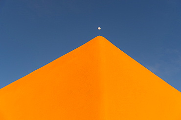 USA, New Mexico, Santa Fe, Moon over adobe pueblo building