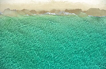 Overhead view of turquoise ocean and beach