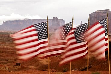 United States, Utah, Monument Valley, American flags blowing in wind