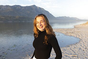 South Africa, Hermanus, Portrait of teenage girl (16-17) on Grotto Beach