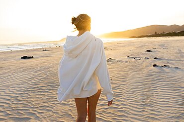 Teenage girl (16-17) walking on Grotto Beach