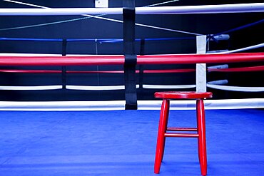 Red stool in boxing ring