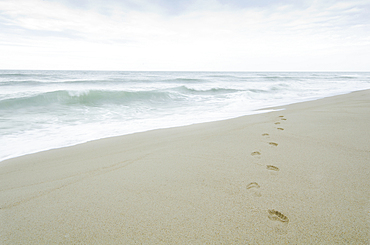 Empty beach on sunny day by Atlantic Ocean