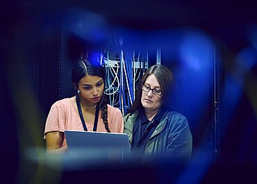 Female technicians working in server room