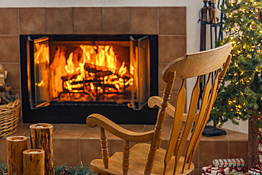 Holiday living room with fireplace and wooden rocking chair