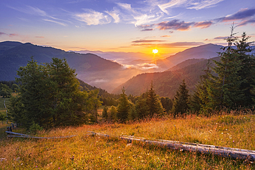 Ukraine, Ivano Frankivsk region, Verkhovyna district, Dzembronya village, Carpathian Mountains landscape at sunset