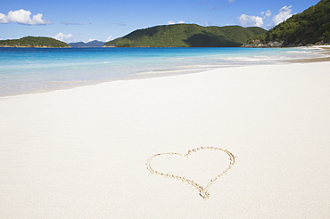 USA, United States Virgin Islands, St. John, Cinnamon Bay, Pair of yellow flip flops on sandy beach